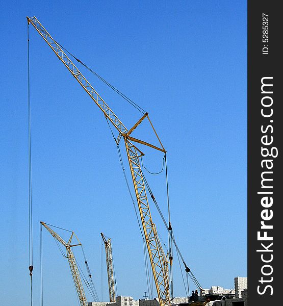 Building crane and the blue sky