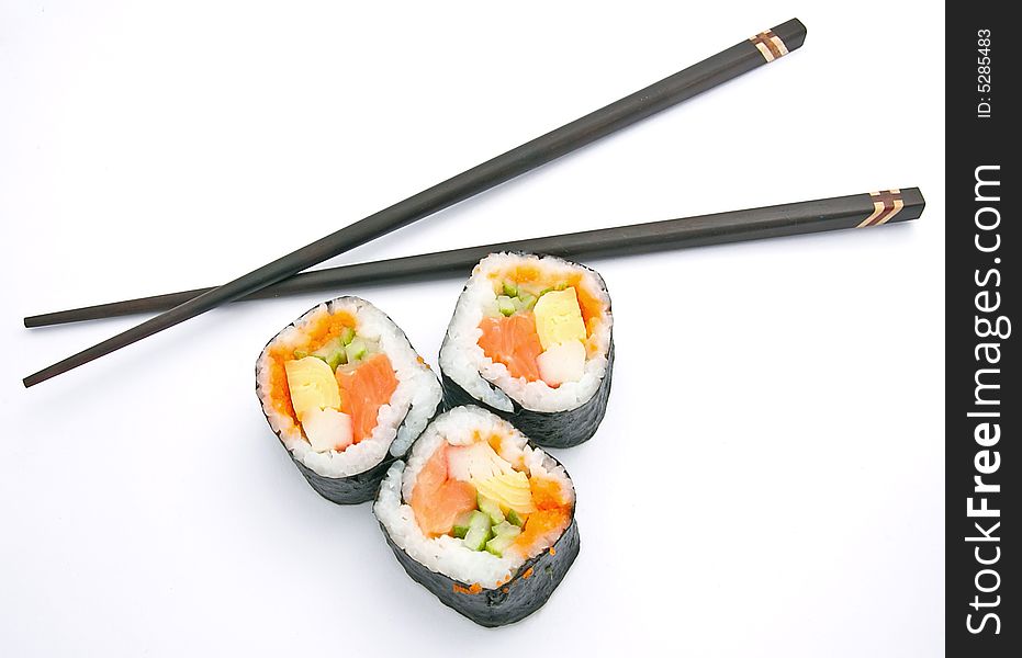Sushi and chopsticks on white. Sushi and chopsticks on white