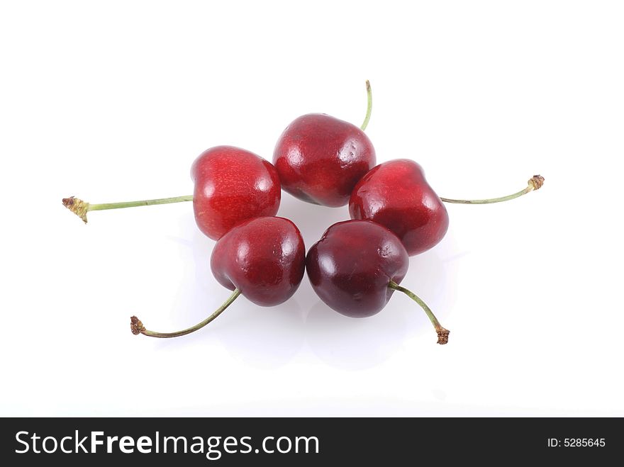 Five cherries isolated on a white background. Five cherries isolated on a white background.
