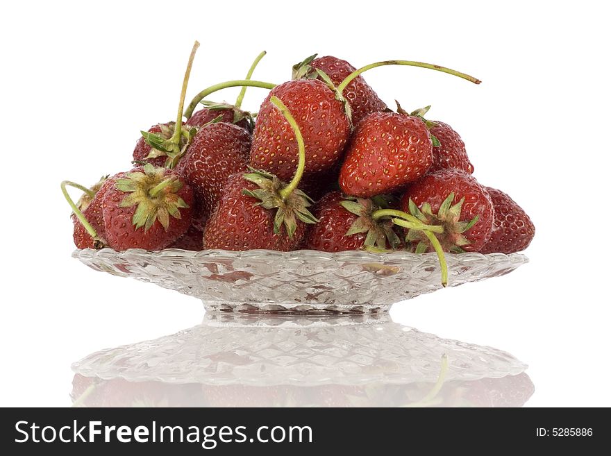 Strawberries on plate isolated on white background