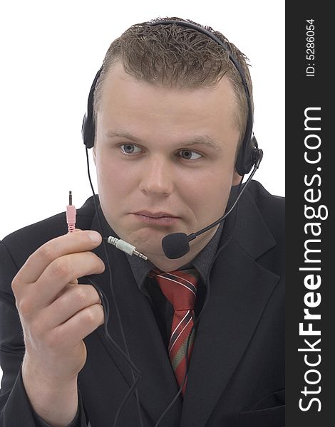 Man telephonist with hands-free phone against a white background. Man telephonist with hands-free phone against a white background