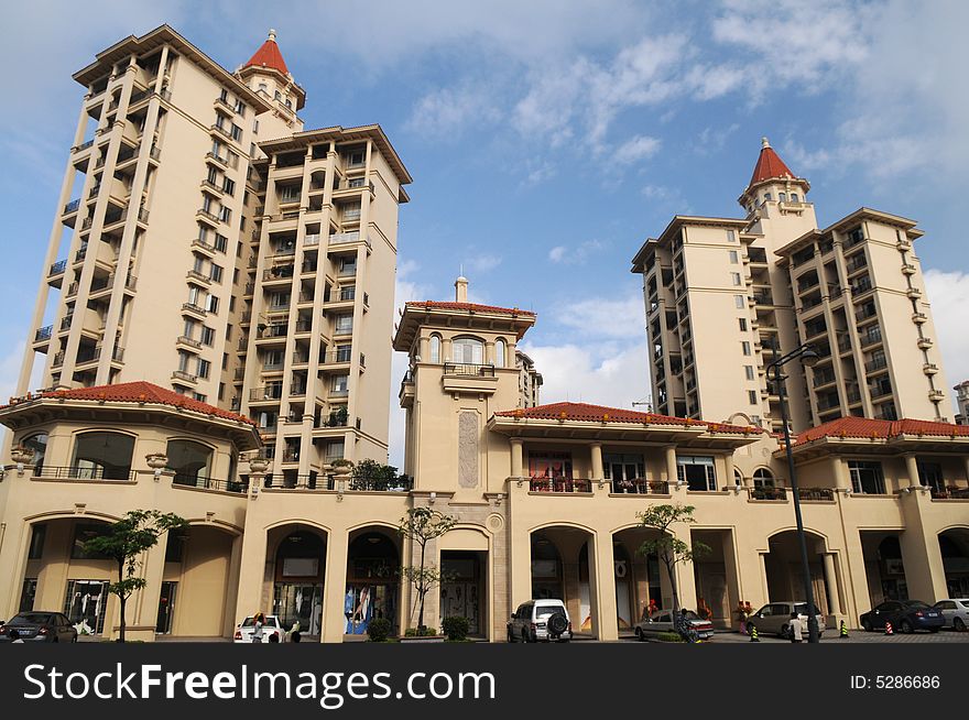 A luxury apartment building with red spires under the blue sky,Foshan,Guangdong,China. A luxury apartment building with red spires under the blue sky,Foshan,Guangdong,China.