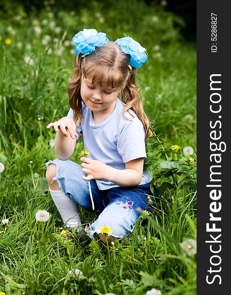 An image of a girl with yellow dandelion