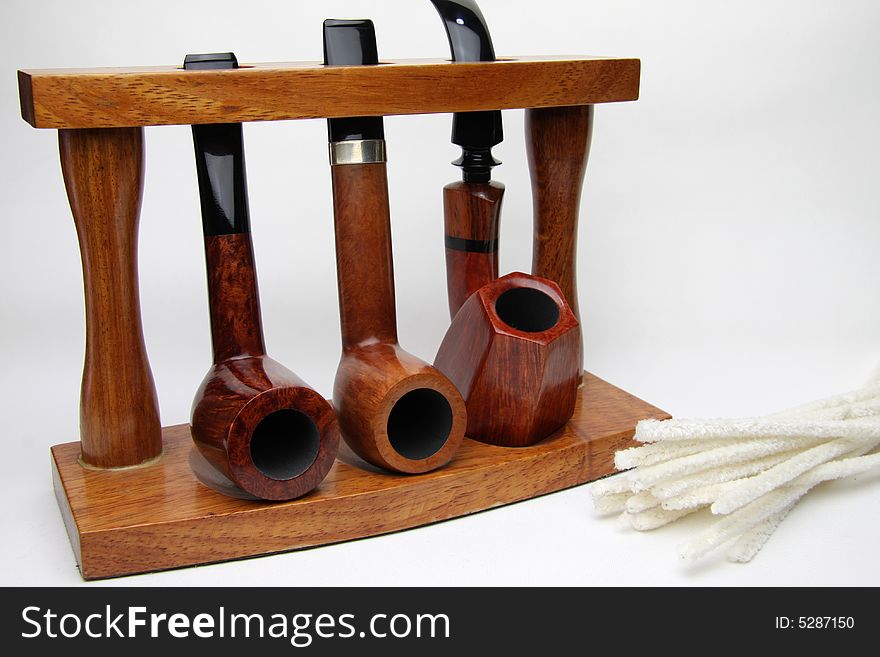 Three tobacco pipes isolated on white.