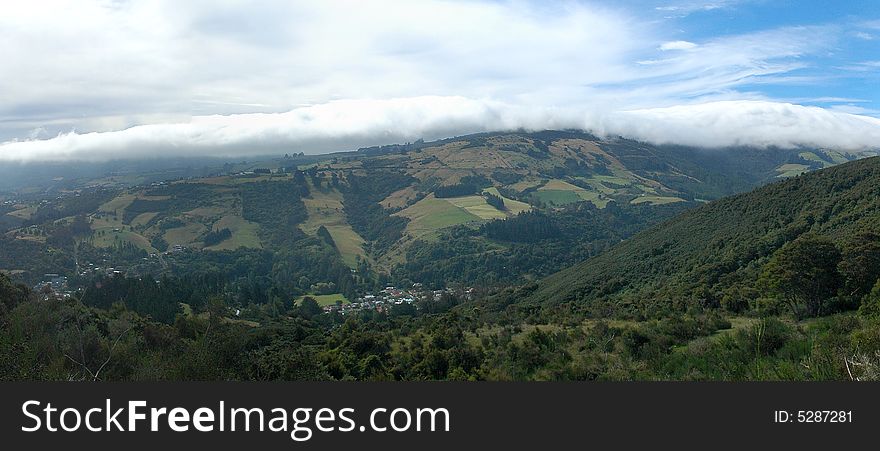 The city of Dunedin, in New Zealand, under cloud blanket. The city of Dunedin, in New Zealand, under cloud blanket.