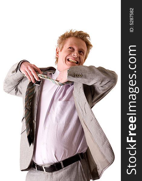 Studio portrait of a middle aged business man tearing of his tie. Studio portrait of a middle aged business man tearing of his tie.