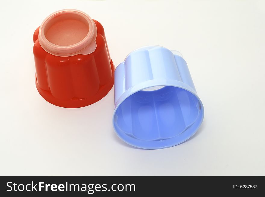 Blue and red jelly moulds for single servings of food