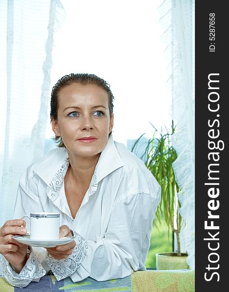 High key portrait of nice gorgeous woman drinking coffee