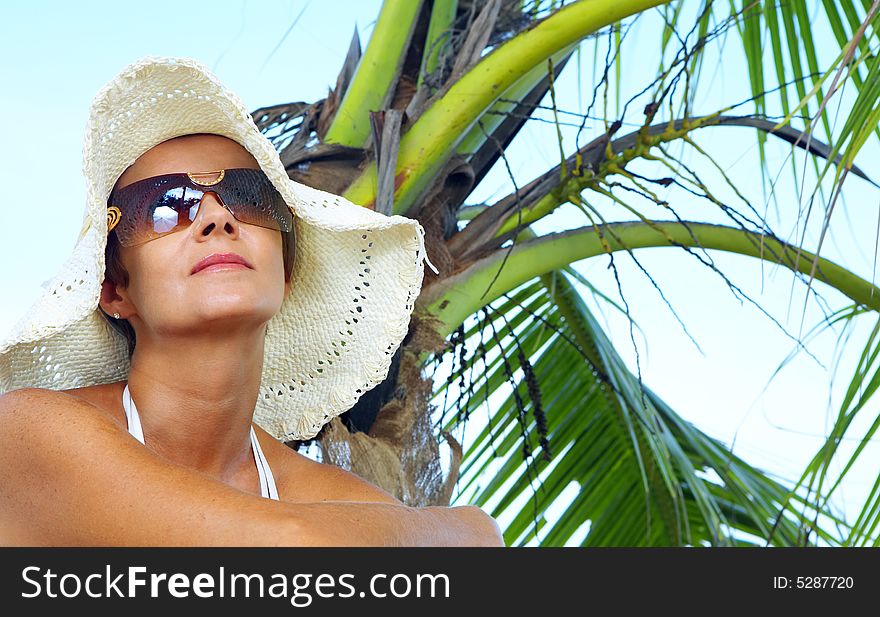 View of nice woman having fun on tropical beach. View of nice woman having fun on tropical beach