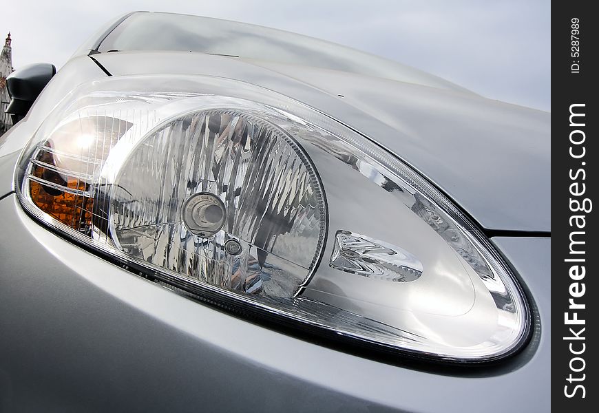 Close up view of a car's headlight.