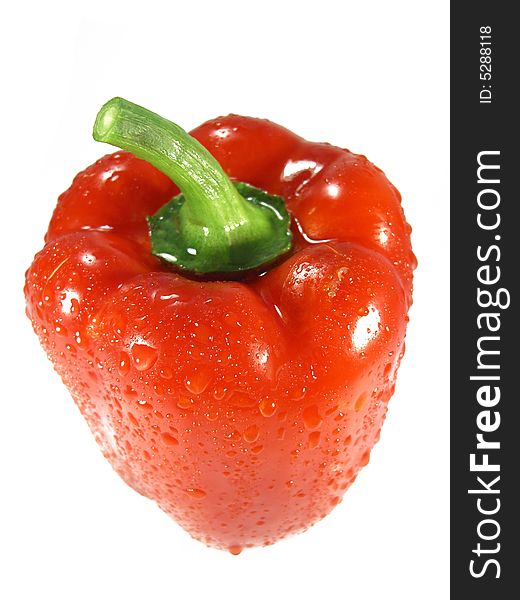 Top view detail on a red pepper bell vegetable with drops of water isolated on a white background. Top view detail on a red pepper bell vegetable with drops of water isolated on a white background.