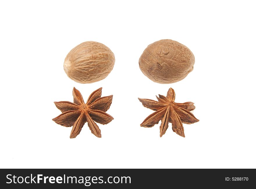 Nutmeg and star anise isolated on a white background