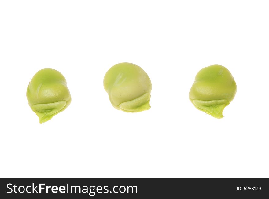 Three broad beans isolated on a white background