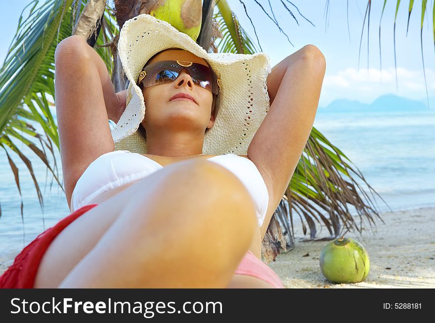 View of nice woman having fun on tropical beach. View of nice woman having fun on tropical beach