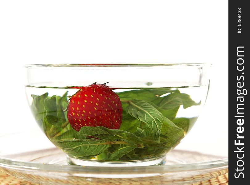 Herbal tea with mint and a strawberry. Herbal tea with mint and a strawberry