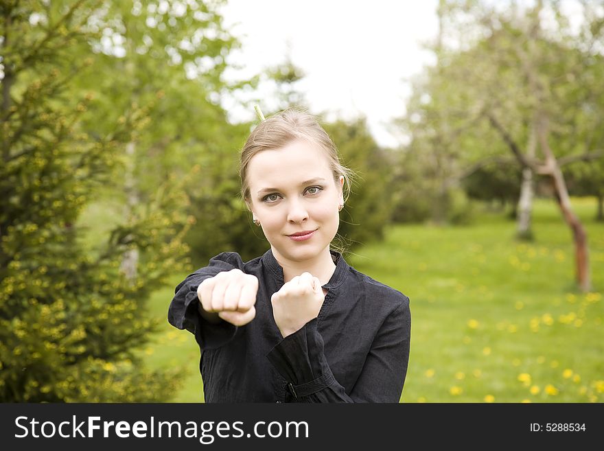 Young Woman Training In The Garden. Young Woman Training In The Garden