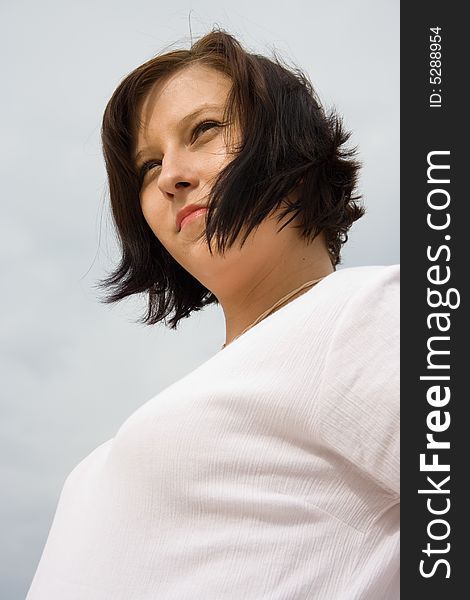 Pregnant woman on the sky background. Pregnant woman on the sky background