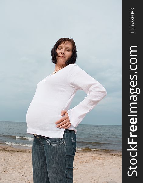 Pregnant woman on the beach. Pregnant woman on the beach