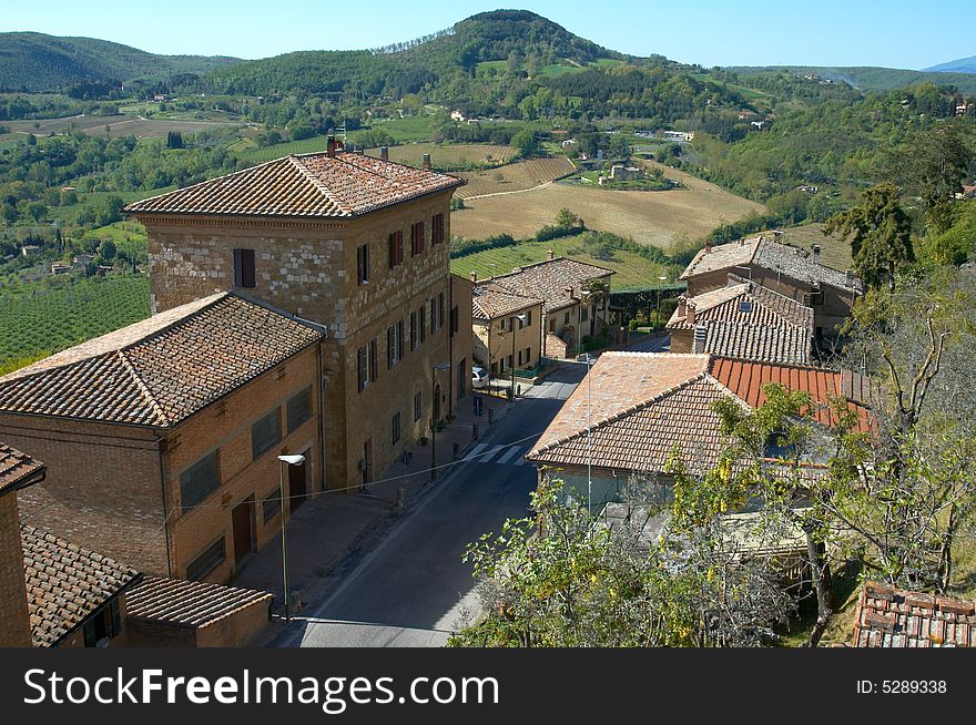 Houses and fields, Montepulciano, in the Tuscany region of Italy. Houses and fields, Montepulciano, in the Tuscany region of Italy