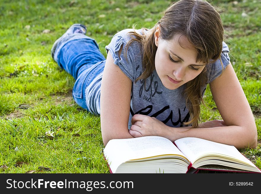 Young woman reading a book