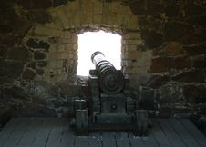 Old Cannon In Front Of The Window Royalty Free Stock Images