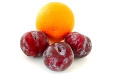 Plums And Orange. Stock Images