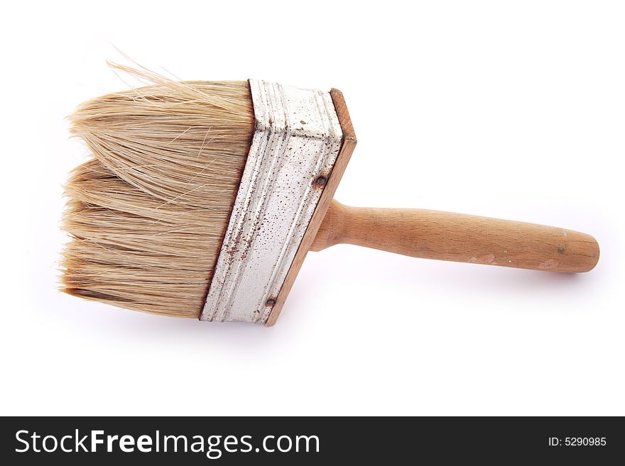 Old brush with wooden hand on the white background. Old brush with wooden hand on the white background.