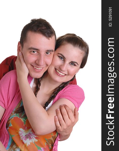 Attractive young couple playfully cuddling - on white. Attractive young couple playfully cuddling - on white