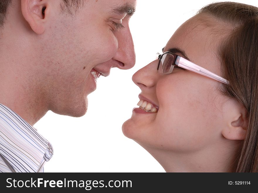 Attractive young couple playfully joking - on white. Attractive young couple playfully joking - on white