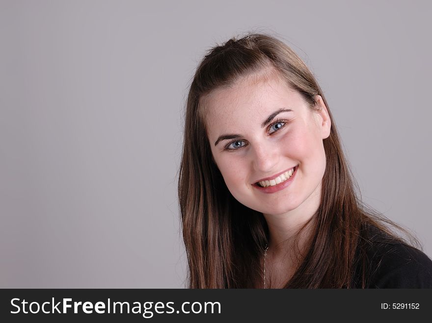 Close up portrait of cute young lady with lovely teeth smiling. Close up portrait of cute young lady with lovely teeth smiling