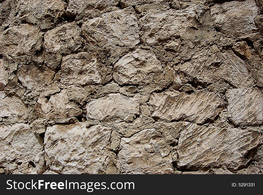 Old stone wall as background. Old stone wall as background