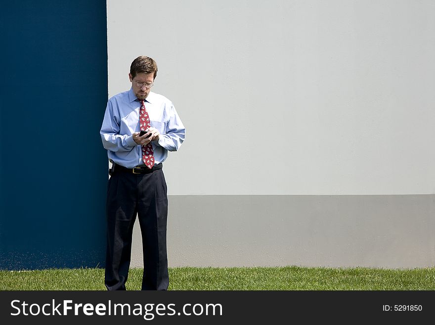 Professional Male at Work on Mobile Device. Professional Male at Work on Mobile Device