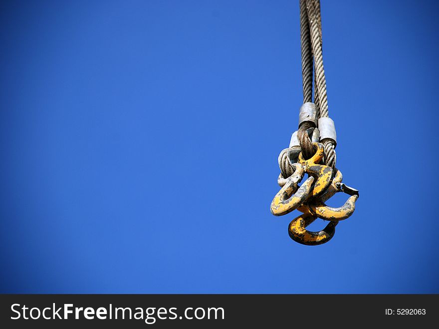 The crane hooks on the straps