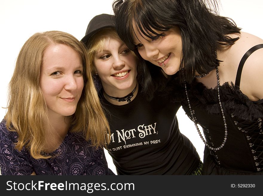 Three happy young girls on white background