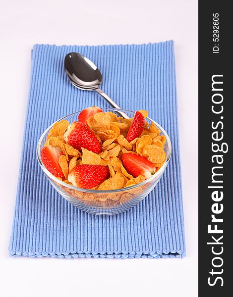 Cornflakes with fresh and very red strawberry. Cornflakes with fresh and very red strawberry