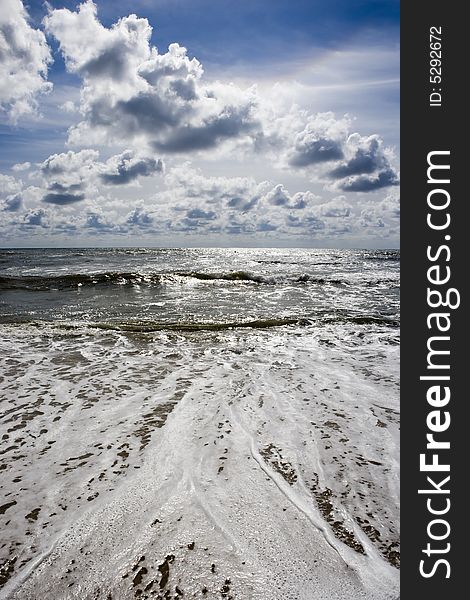 Beach seascape with deep blue sky