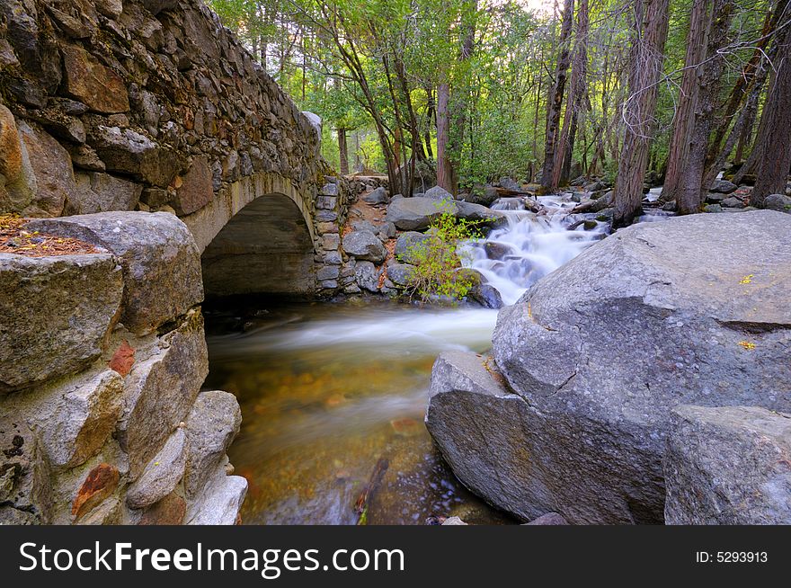 A secluded stone bridge in the forest in Yosemite National Park in spring