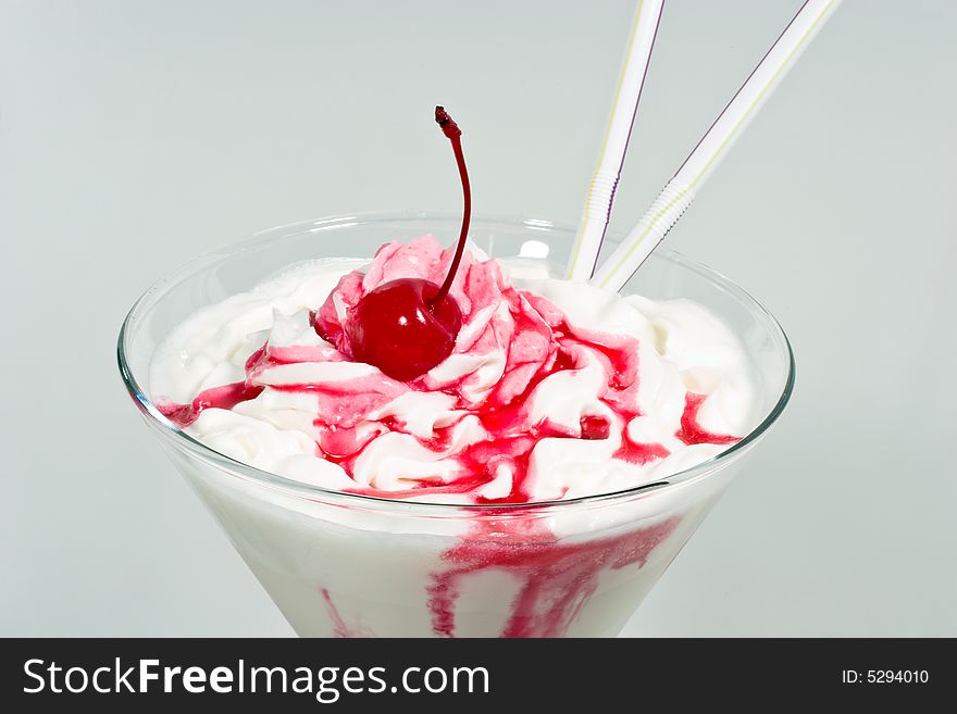 Red cherry, whipped cream, milk color. Red cherry, whipped cream, milk color