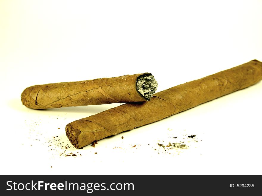 Cigars and ashes on white background. Cigars and ashes on white background