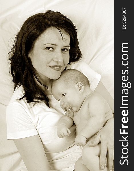 Mom and little baby girl over white background