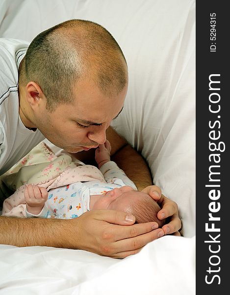 Dad and little baby girl over white background