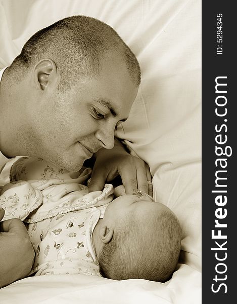 Dad and little baby girl over white background