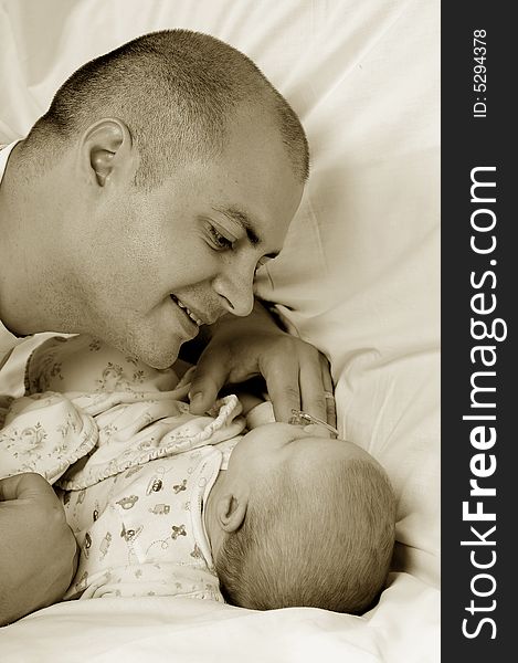 Dad and little baby girl over white background