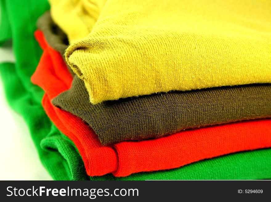 Pile of cotton colorful pullovers. Pile of cotton colorful pullovers