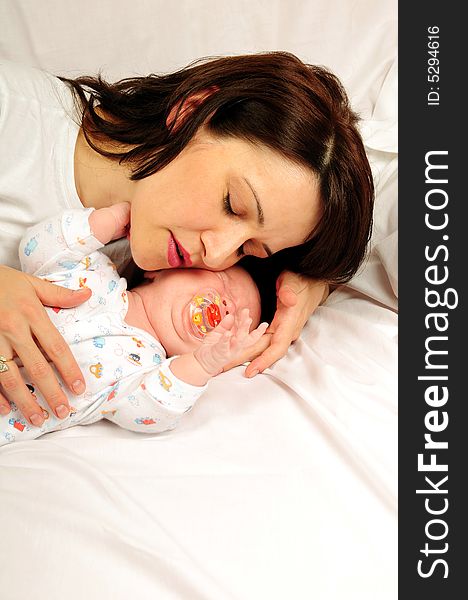 Mom and little baby girl over white background