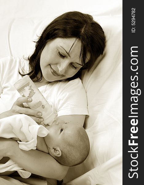 Mom and little baby girl over white background