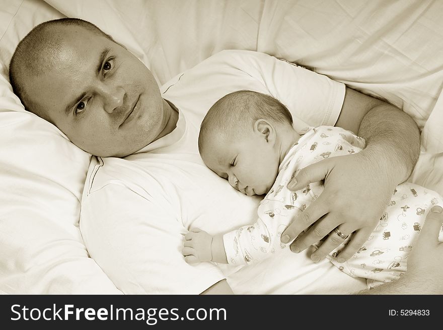 Dad and little baby girl over white background