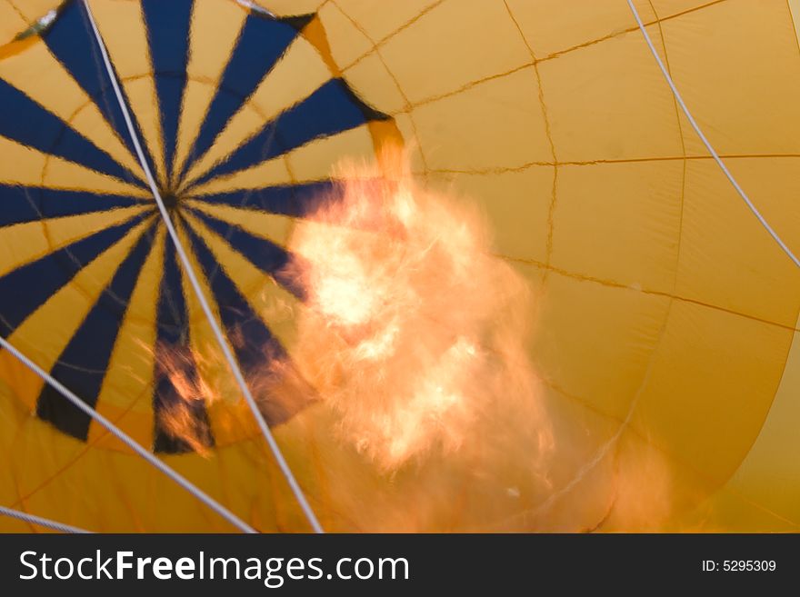 A flame is using to inflate hot air balloon