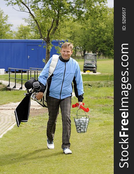 Golf player walk with his club bag and balls. Golf player walk with his club bag and balls