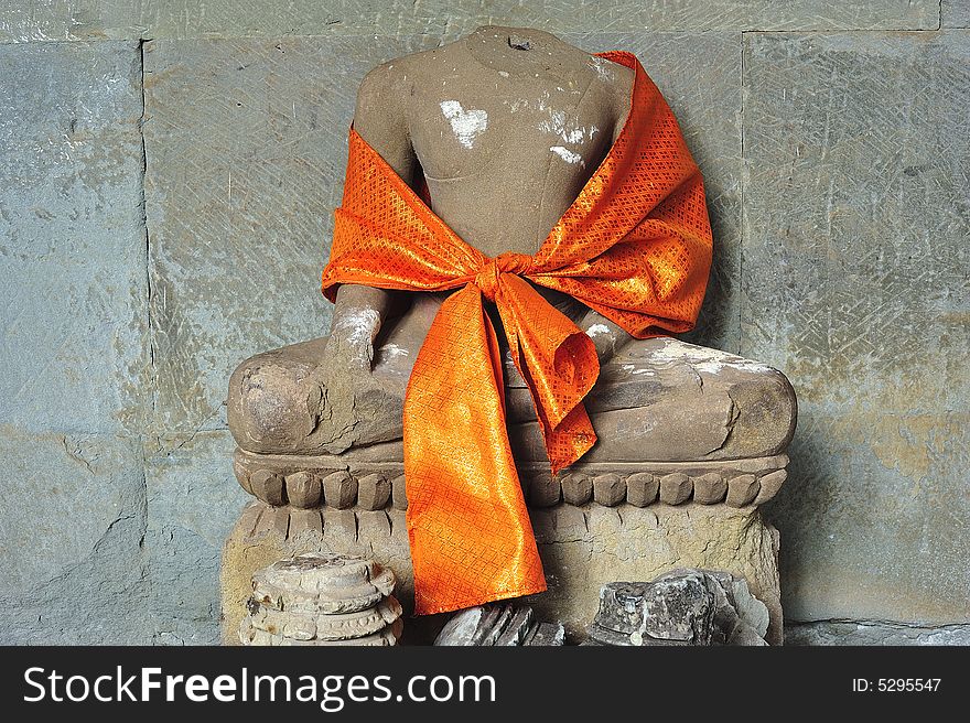 Angkor Wat is probably the biggest and the most famous temple in the world constructed in the 12th century by the king Suryavarman II. here a seated buddha inside the temple. Angkor Wat is probably the biggest and the most famous temple in the world constructed in the 12th century by the king Suryavarman II. here a seated buddha inside the temple